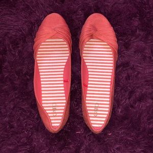 Peach coloured flats.